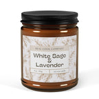A 9oz amber glass jar candle with a black metal lid and a white paper label reading 'White Sage & Lavender' by Real Cool Company,