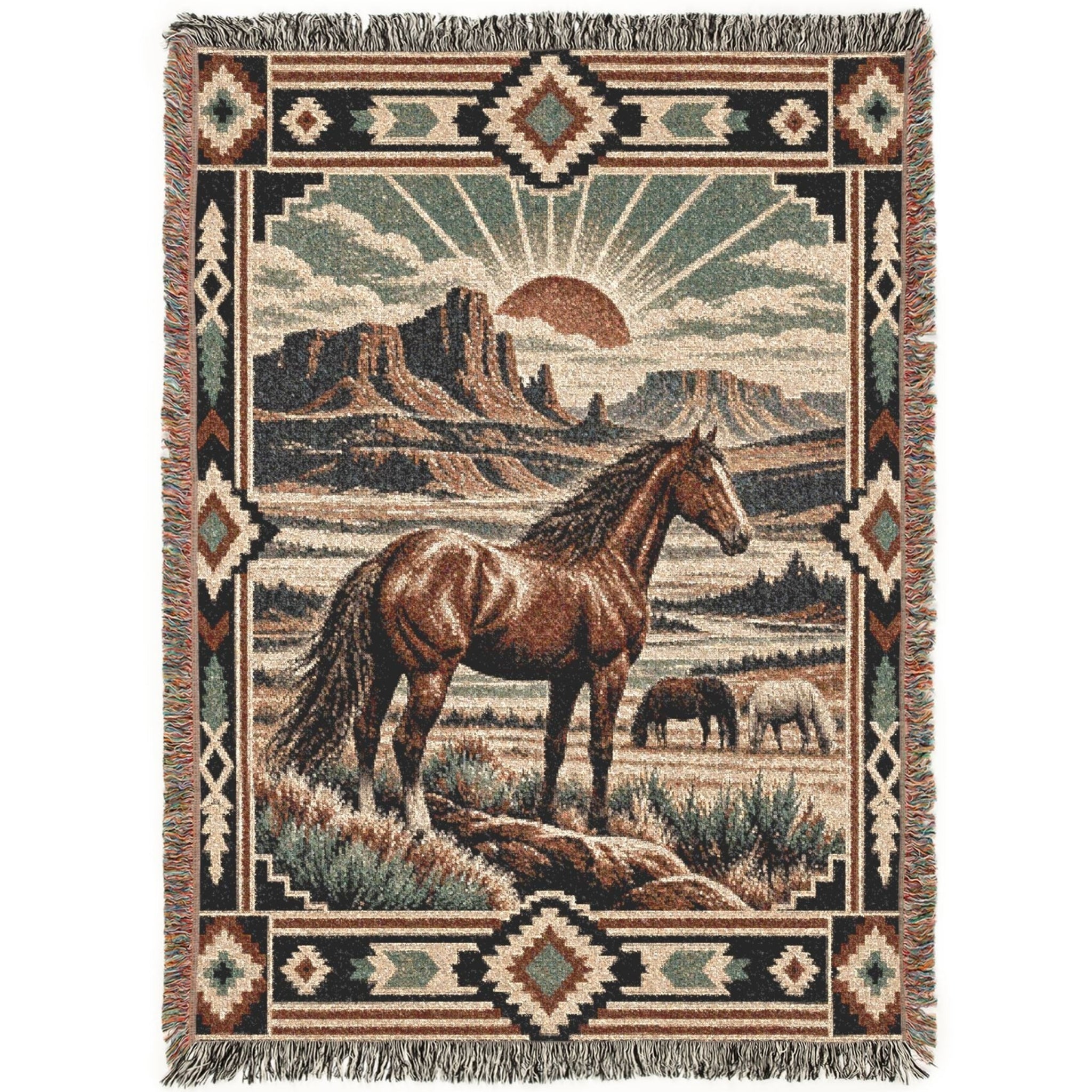 A rectangular woven throw blanket with fringe on all sides, featuring a western landscape scene with a brown horse in the foreground, a smaller animal in the distance, desert mountains, and a sunburst. The border includes geometric patterns in beige, brown, black, and muted green.