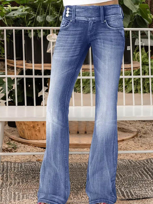 Woman wearing Vintage Wash Flare Jeans standing in front of botanical garde