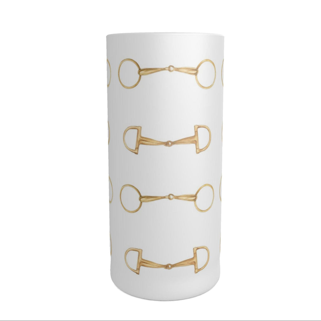 A tall frosted cylindrical shot glass decorated with a repeating pattern of gold horse bits, shown against a plain white background.