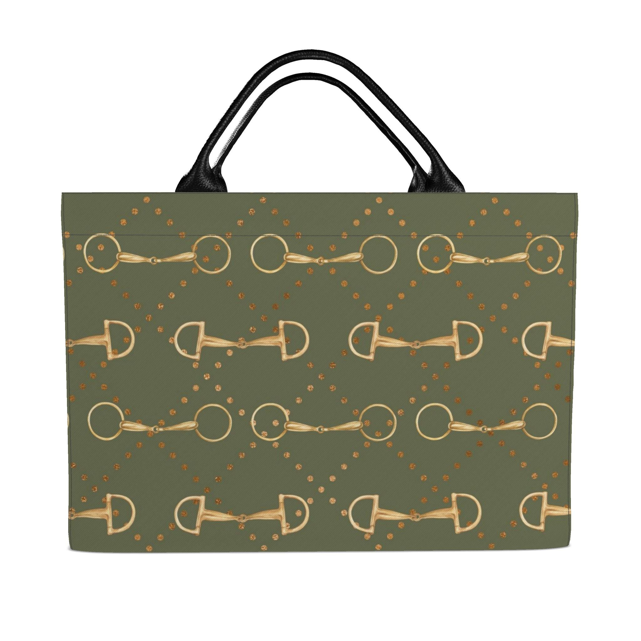 front of An olive green tote bag with a repeating pattern of gold horse bits and gold dots, featuring black shoulder straps, shown against a plain white background.