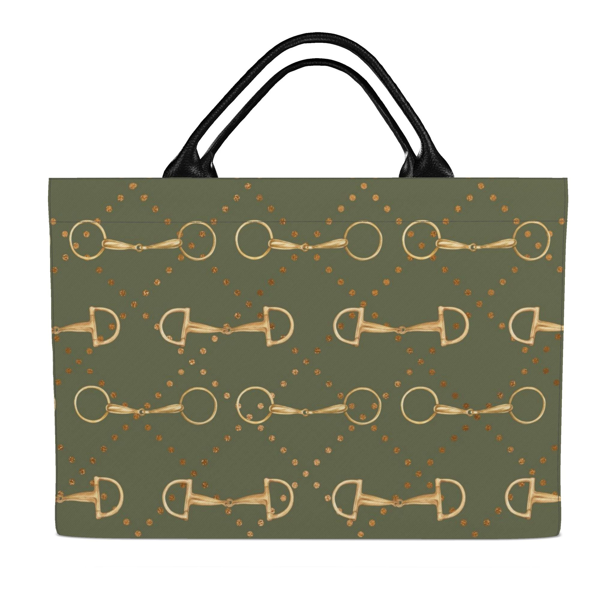 back of An olive green tote bag featuring a repeating pattern of gold horse bits and small gold dots, with black shoulder straps, shown against a plain white background.