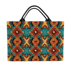 front side of tote bag featuring a vibrant, symmetrical geometric pattern in teal, rust red, orange, and gold, with black shoulder straps, shown against a plain white background.